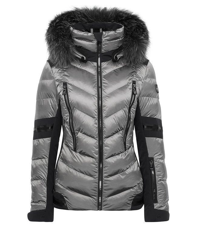 The ski jacket Nele Splendid Fur brings functionality and fashion-esprit to the ski piste. It is reliably warm, thanks to its highly insulating fibre balls, and is made for every type of weather. This branded Toni Sailer ladies jacket has a feminine 